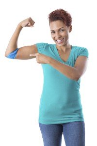 Woman pointing at bandage on arm